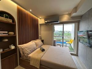 Cozy 1 BR condo unit near Tomas Morato