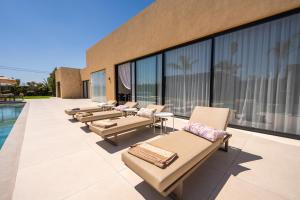 Villa prestige, terrain padel, salle de sport, hammam