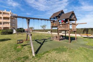 Apartamento bajo con jardin a 1ª linea de playa