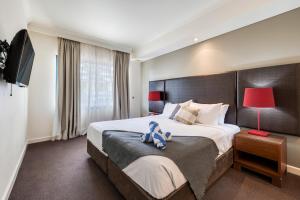 Resort Style Getaway with King Bed Pool and Balcony