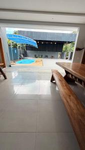 Large barbecue area with a swimming pool and a spacious room