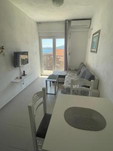 Bright spacious one-bedroom apartment with stunning seaview of Boka Bay right by the beachfront