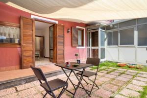 GuestHost - Lapilli e Miracoli Flat with Patio