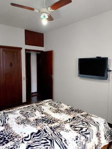 Quarto no apartamento do anfitrião na Praia do Canto