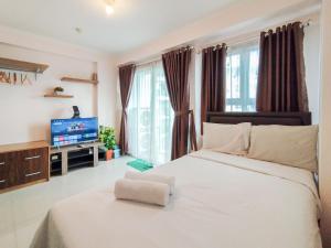 Contemporary Style 1BR Apartment at Gateway Pasteur By Travelio