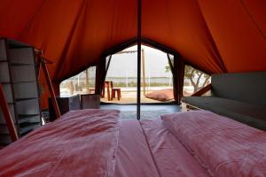 Stylish Glamping Tent Stay with Shaded Terrace & Ambient Lighting in Faro District, Portugal