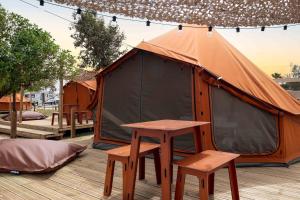 Stylish Glamping Tent Stay with Shaded Terrace & Ambient Lighting in Faro District, Portugal