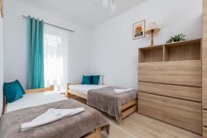 Przytulny Apartament Blisko Zatoki Wrzosowskiej by Noclegi Renters