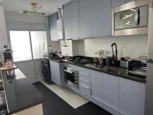 Apartamento a menos de 100 m da praia Asturias - Guarujá Beach