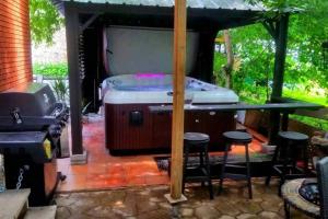 Petit loft avec terrasse exotique et jacuzzi privé
