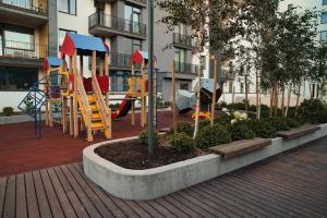 Modern central Riga apartment with balcony, gym access, dedicated parking, kitchen & AC