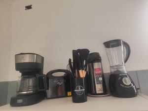 Quartos compartilhados com cozinha equipada