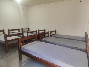 Quartos compartilhados com cozinha equipada