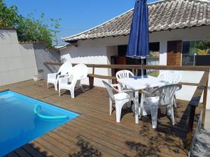 Casa 3 suites com ar, piscina, salão festas, jardim, estacionamento e muito espaço!