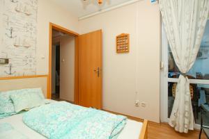 992 - Balatonőszödön közvetlen vízparti, teljes panorámás apartman