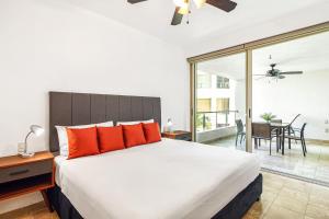 Modern ocean-view stay with pool and rooftop access, large balcony, and AC