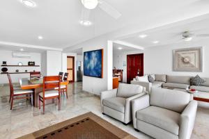 Luxury hillside suite with infinity pool, ocean views, hot tub & terrace seating