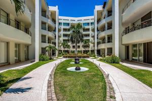 Ground-floor condo with resort pool, balcony, & pool tables