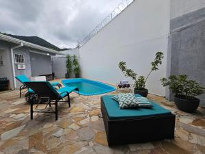 Casa Brisa do Centro Caraguá - espaçosa 500m2- 4 Quartos- piscina privativa -churrasqueira-forno de pizza