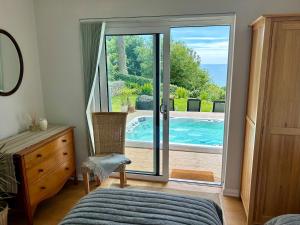 Stunning property with sea views and heated swimspa
