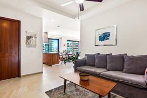 5th-floor condo with partial ocean views, heated pool, sauna, gym, balcony, WD