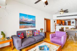 Beachfront 4th-floor condo with views, outdoor pool, balcony, WD & central AC