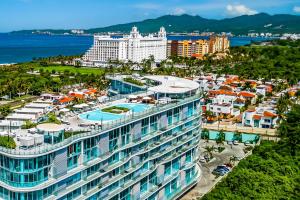Stylish ocean-view condo with pool, gym, private balcony, AC, & WiFi
