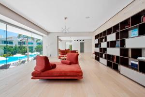 Stylish ocean-view condo with pool, gym, private balcony, AC, & WiFi