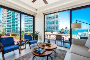 5th-floor condo with partial ocean views, heated pool, sauna, gym, balcony, WD