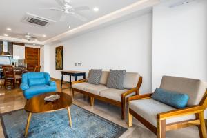 Oceanfront condo with rooftop infinity pool, panoramic views, balcony, gym, & AC