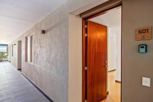 Enchanting & modern beach retreat with pool, gym, & breathtaking balcony views