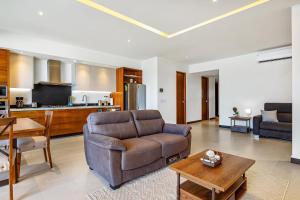 Enchanting & modern beach retreat with pool, gym, & breathtaking balcony views