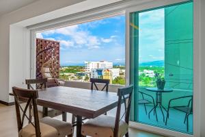 Enchanting & modern beach retreat with pool, gym, & breathtaking balcony views