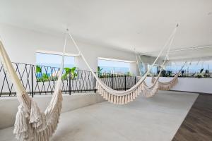 Resort condo with balcony, views, rooftop pool, gym, & full kitchen