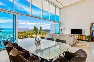 Luxury ocean-view condo with resort pool, private balcony, and washerdryer
