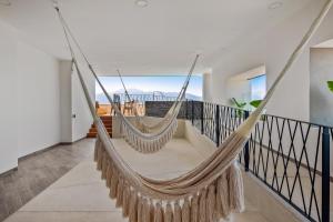 Resort condo with balcony, views, rooftop pool, gym, & full kitchen