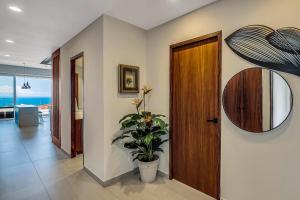 Modern waterfront condo with shared pool, balcony, and washerdryer