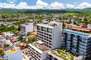 Modern waterfront condo with shared pool, balcony, and washerdryer
