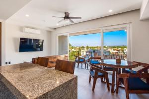 Resort condo with balcony, views, rooftop pool, gym, & full kitchen