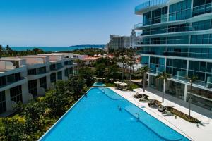 Golf-and-sea condo with panoramic oceanmountain views, pool