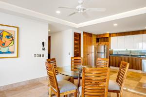 Luxurious 1st-floor condo with pool, oceanfront balcony & water view
