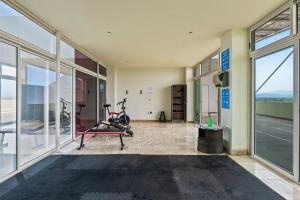 Stylish beach condo with private balcony, pool, AC and fitness room