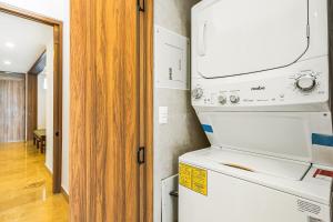 Serene coastal getaway with private infinity pool, beach access & scenic vistas