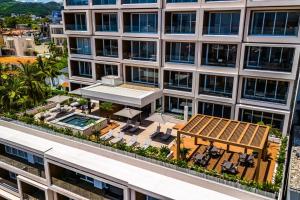 Modern waterfront condo with shared pool, balcony, and washerdryer
