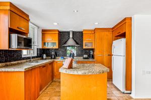 Spacious condo with near the beach with resort-style pool, inviting balcony