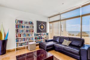 Spacious condo with near the beach with resort-style pool, inviting balcony