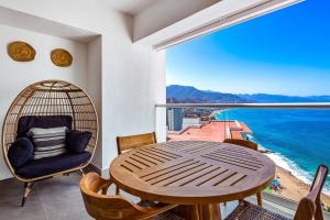 Luxury oceanfront apartment with private balcony, rooftop pool & gym access