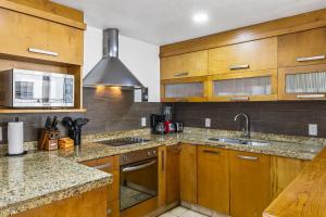 Chic coastal condo with private balcony, pool access & steps to the beach