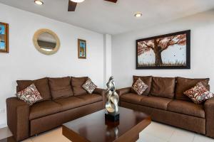 Mismaloya Beach condo with ocean views, on-site pool, grill, & private balcony