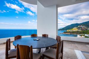 Upscale oceanfront condo with extensive balcony, pool & ocean views
